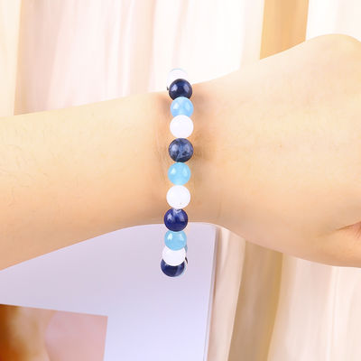 Un bracelet en quartz clair / sodalite / calcédoine bleue 8 mm en cristal à perles d'énergie positive