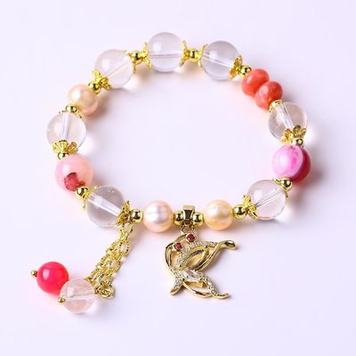 Un bracelet à perles de 10 mm et une pierre précieuse.