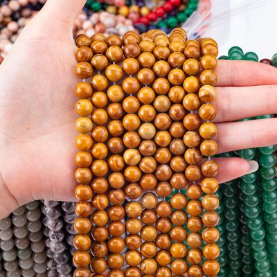 Perles rondes de bois jaune de grain de cristal naturel de pierre précieuse de bois de jaspe de perles lâches pour la fabrication de bijoux