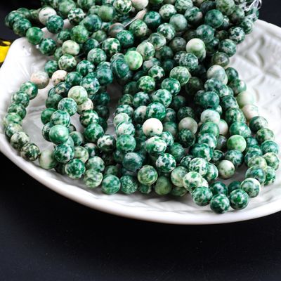 Perles rondes à taches bleues de cristal naturel de pierre précieuse
