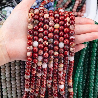 Des perles de pierre précieuse de jaspe rouge naturel poli pour bijoux uniques