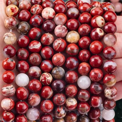 Des perles de pierre précieuse de jaspe rouge naturel poli pour bijoux uniques