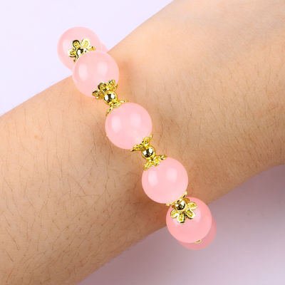 Bracelet en perles de quartz rose 12 mm sur mesure avec charme de cerf