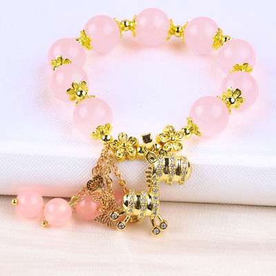 Bracelet en perles de quartz rose 12 mm sur mesure avec charme de cerf