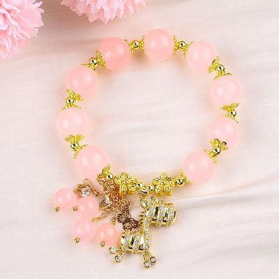Bracelet en perles de quartz rose 12 mm sur mesure avec charme de cerf