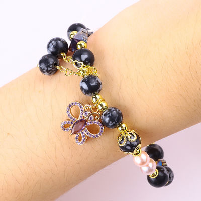8 mm de pierre naturelle de guérison, flocon de neige, obsidienne avec un bracelet en perles de papillon violet.