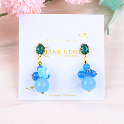 Des boucles d'oreilles en bleu de calcédoine cristalline faites à la main DIY pendentif ovale en perles de perles adaptées au port quotidien