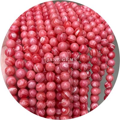 Des perles de pierre précieuse en rhodochrosite à rayures noires naturelles pour les bijoux