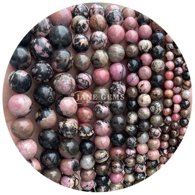 Des perles de pierre précieuse en rhodochrosite à rayures noires naturelles pour les bijoux