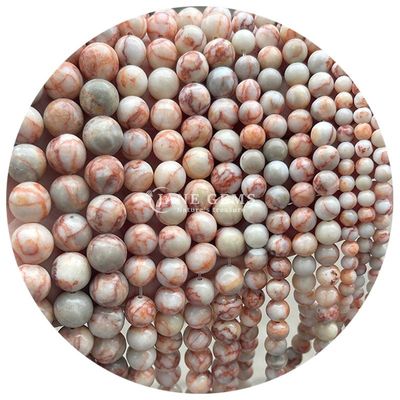 Des perles de pierre précieuse en rhodochrosite à rayures noires naturelles pour les bijoux