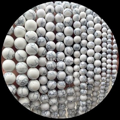 pierre précieuse de forme ronde Howlite Rohdonite pierre cristalline